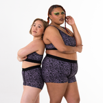 Jacqueline and Kathryn posing back to back in stormy lace boxer briefs