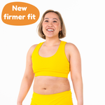 Jacqueline is wearing a marigold yellow bralette and briefs