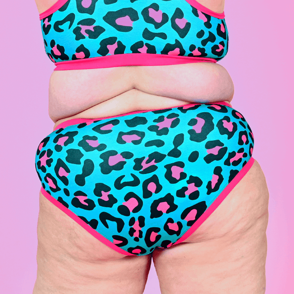 back view of model wearing teal and hot pink leopard high waist briefs
