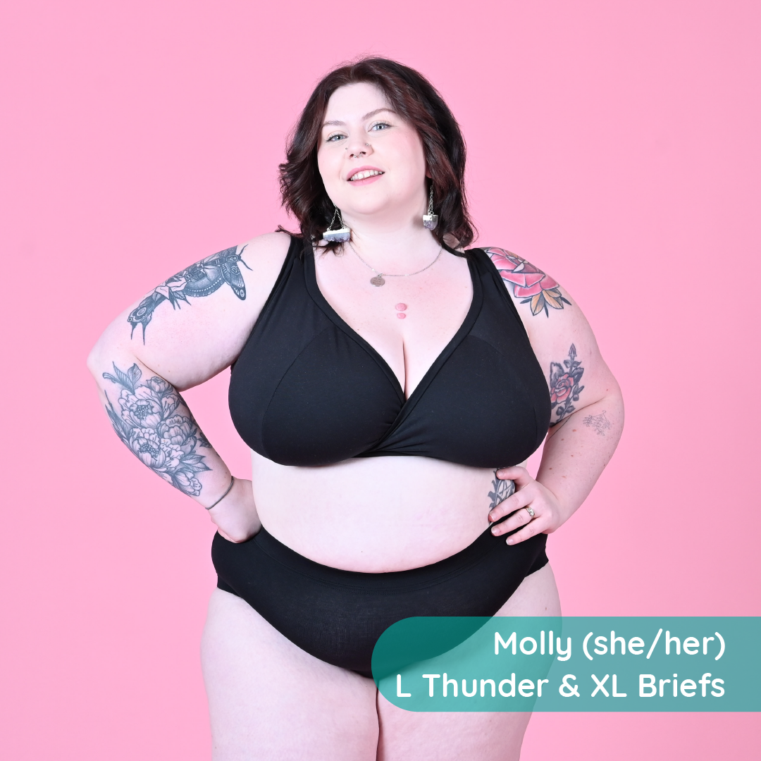 Molly is wearing a black wirefree bra and high rise briefs