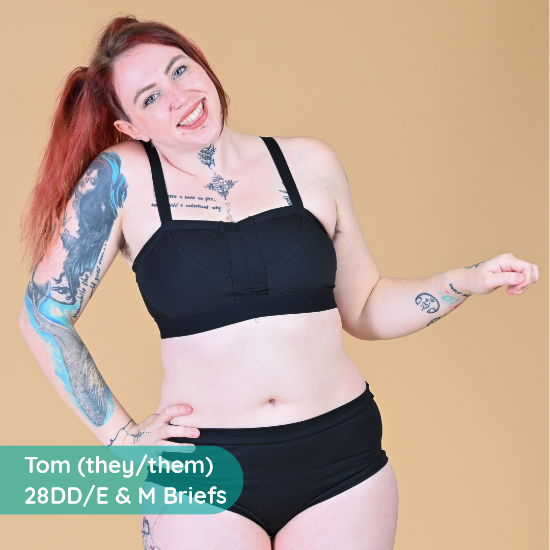 Tom is wearing a black flexi-size bra and briefs
