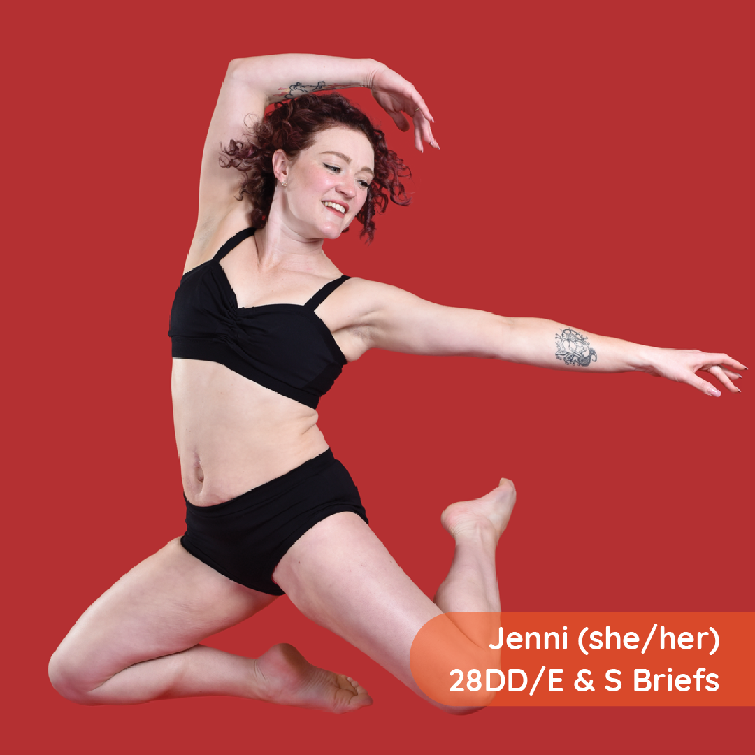 Jenni is mid leap wearing a black cotton underwear set