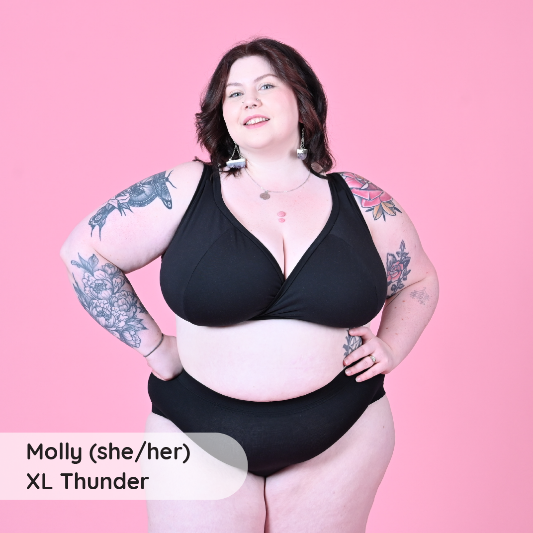 Molly is wearing a black non wired fuller bust bra and briefs