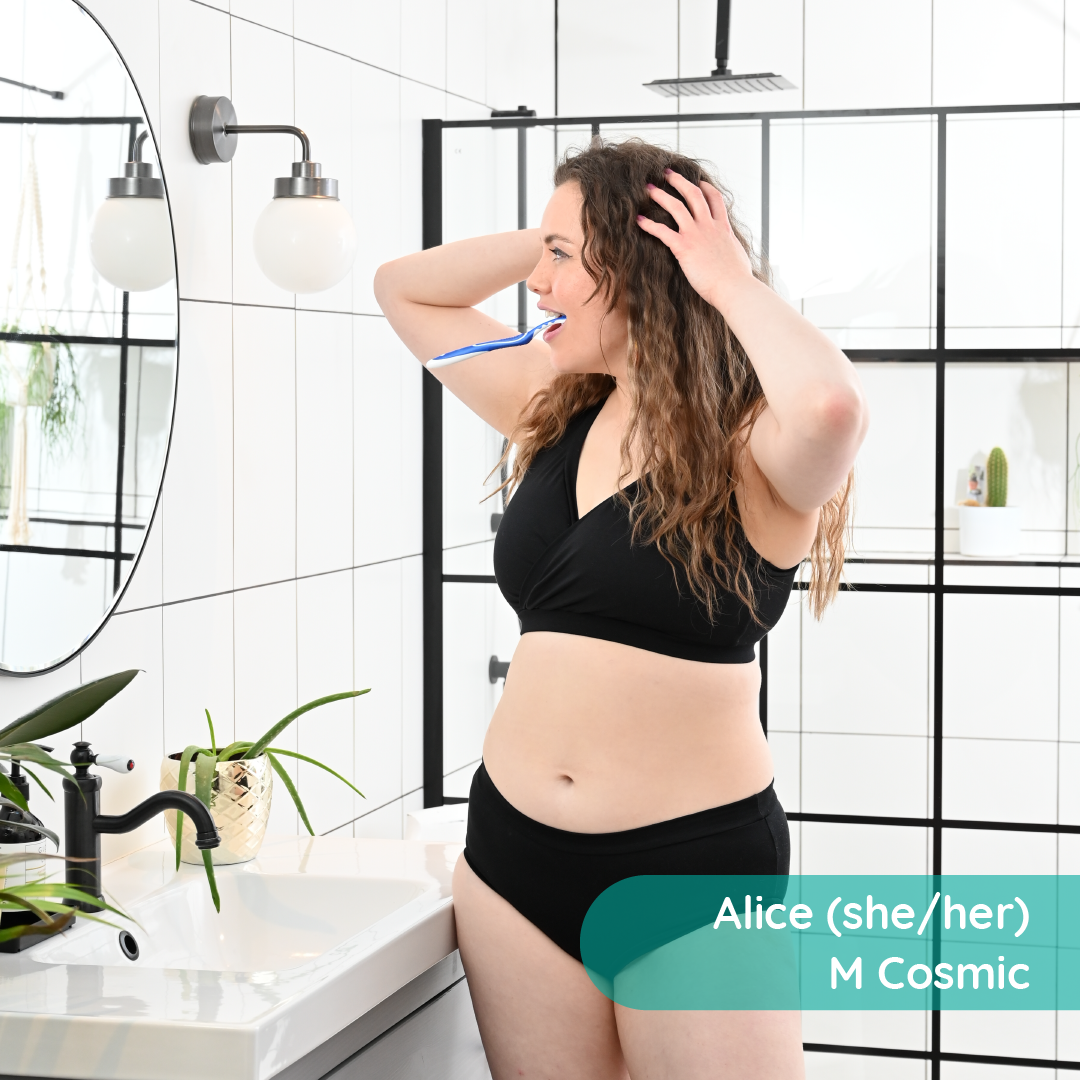 Alice is cleaning her teeth wearing a non wired black underwear set