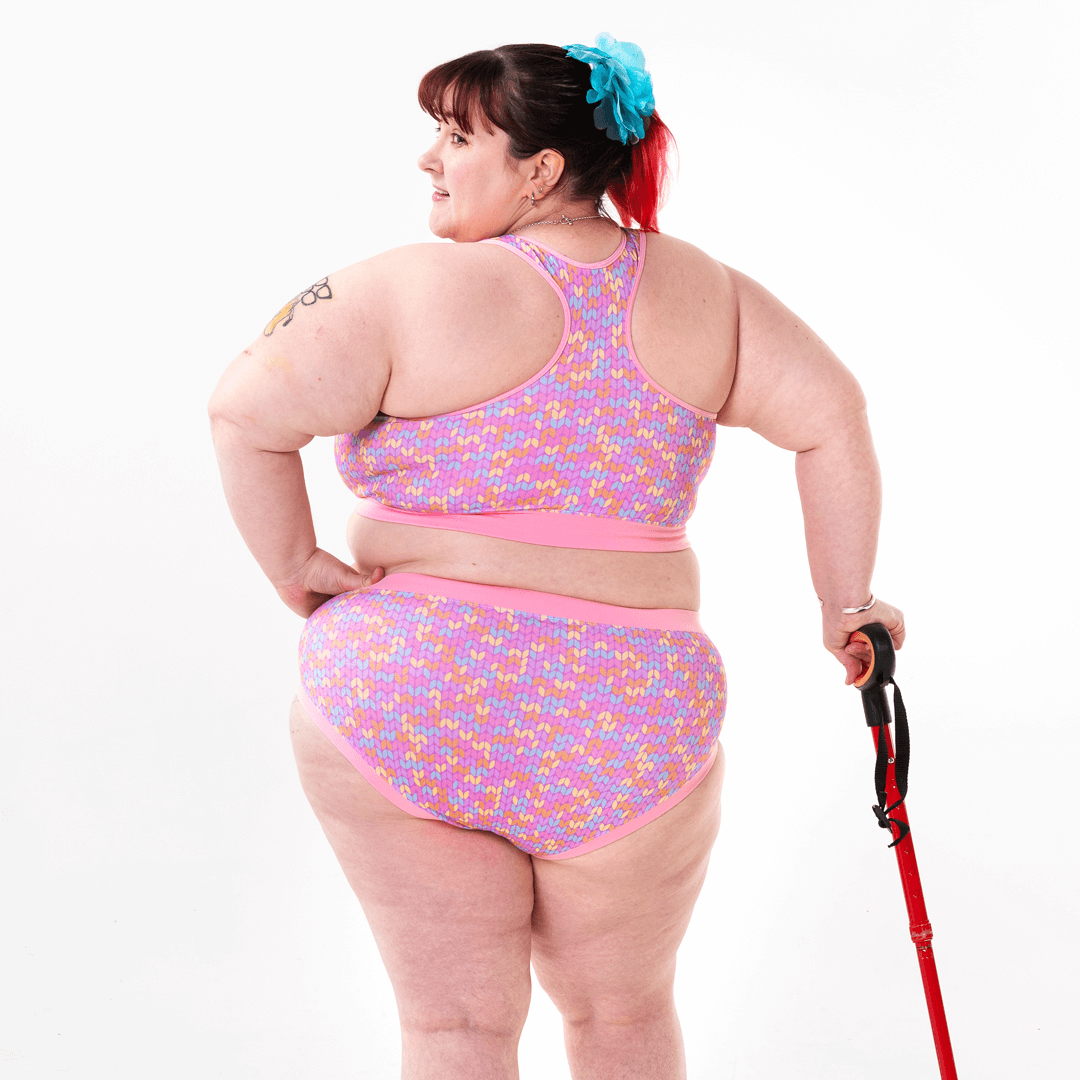 Back view of Rhona wearing a racerback bralette and briefs