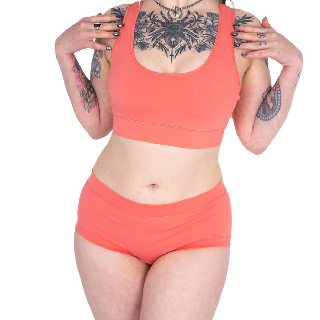 Crop of Faeryn wearing a Coral bralette and mid rise briefs