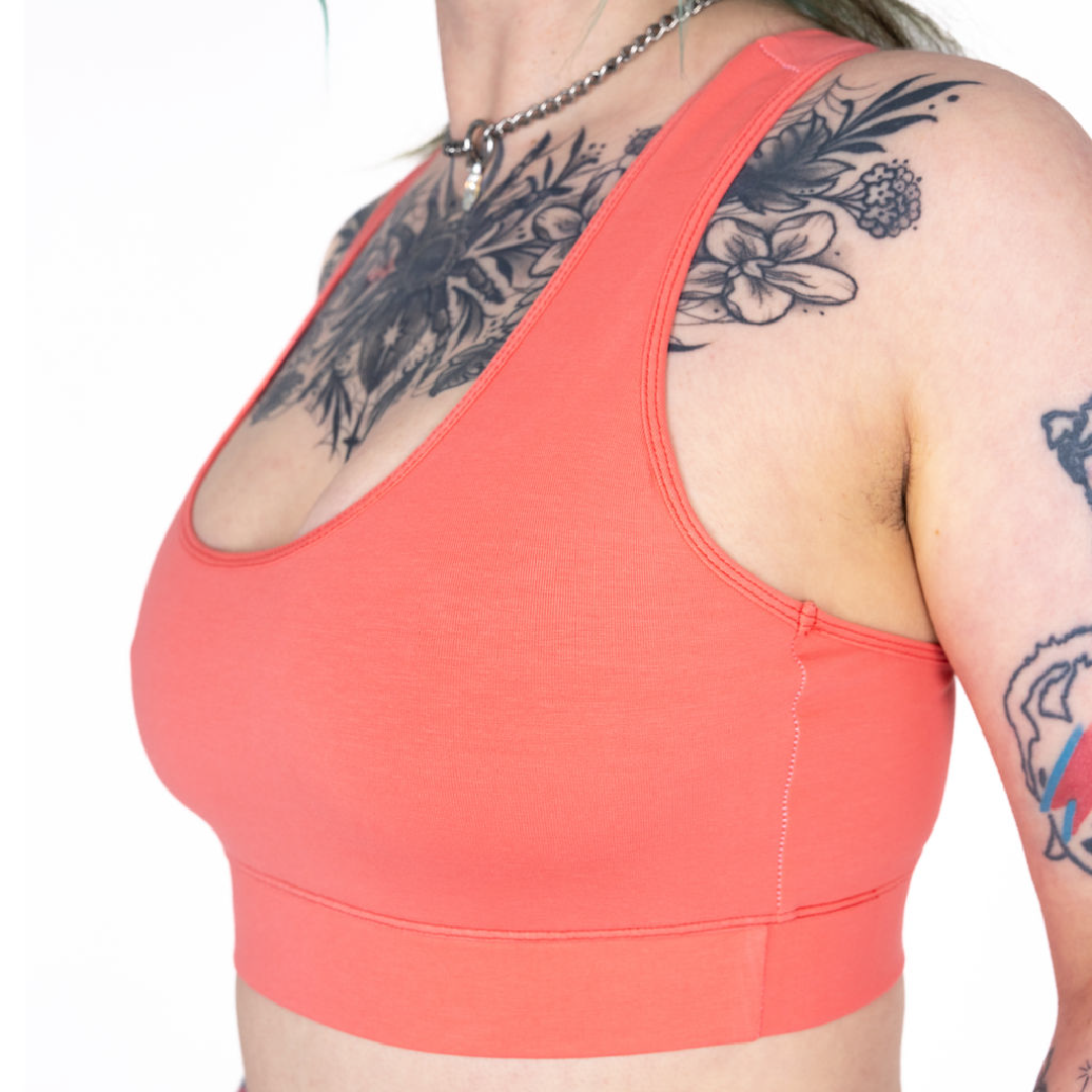 Close up of Faeryn wearing a Coral racerback bralette 