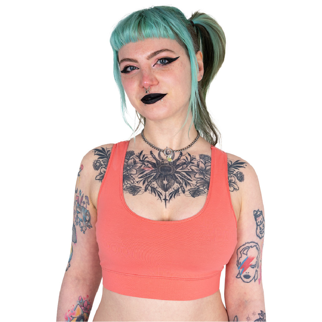Faeryn is wearing a Coral racerback bralette