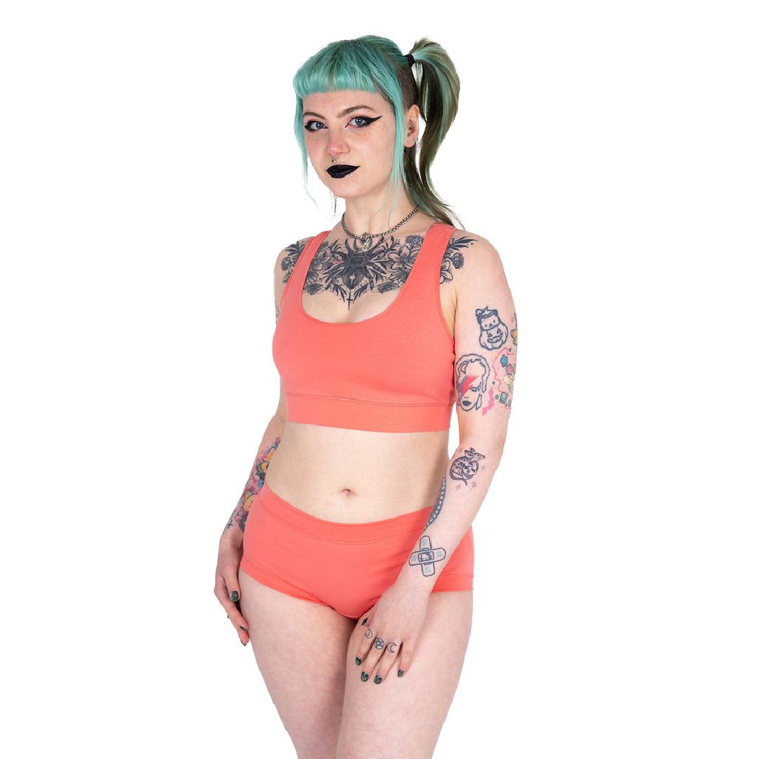 Faeryn is wearing a Coral racerback bralette and cotton briefs