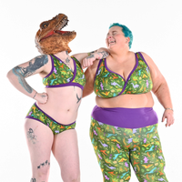 Tom is wearing a Dino underwear set and mask with Estelle in dino bra and dino leggings