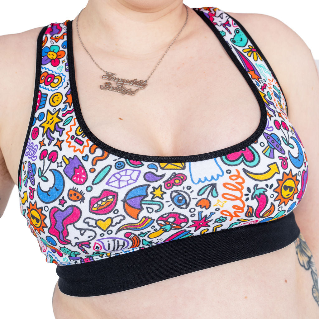 Close crop of Eliza wearing the doodles bralette