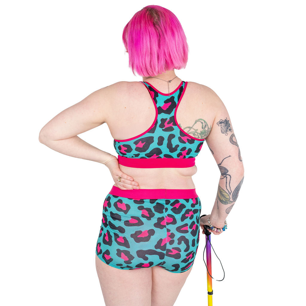 Back view of Eliza wearing a Hot Leopard racerback bralette and boxers
