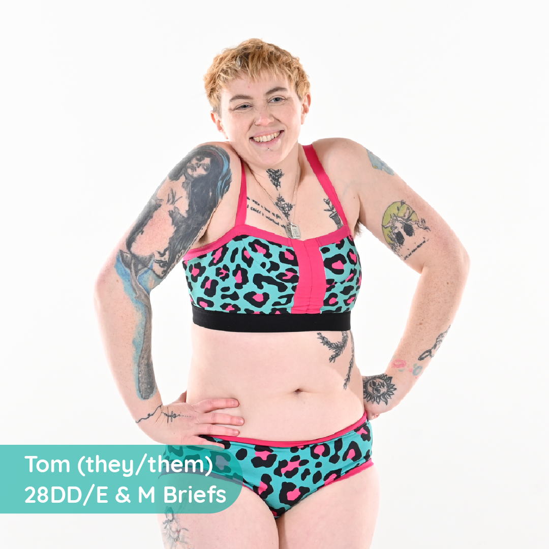 Tom is wearing a pink, black and teal non wired bra in leopard print
