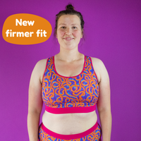 Katy is wearing a wiggles racerback crop top bralette and briefs. Text reads 'New firmer fit'