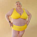 Julie is wearing high rise briefs and non-wired bra in marigold yellow