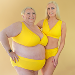 Julie and Steph and standing wearing matching yellow Marigold bra and briefs