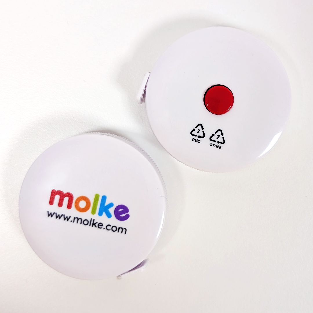 Two white circular tape measures with a red button and 'molke' branding on a white background