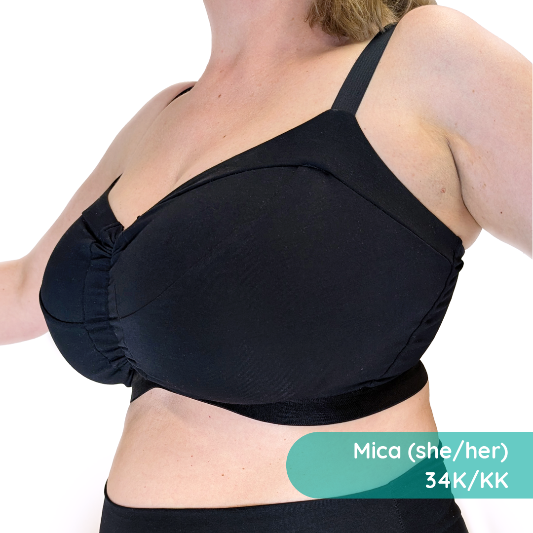 Close crop of a person wearing a supportive black cotton wire free bra