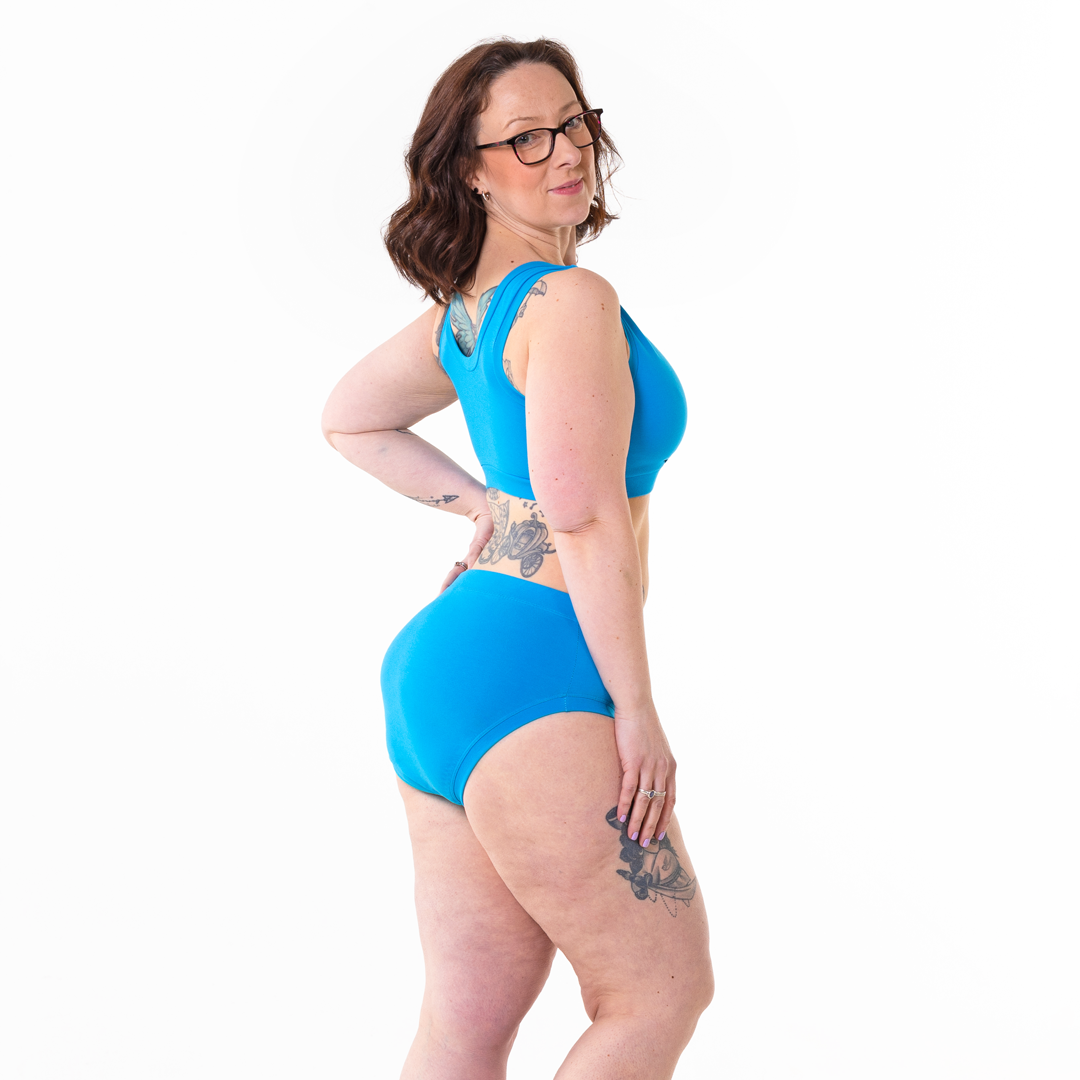 Kat is wearing high rise cotton briefs and bra in blue