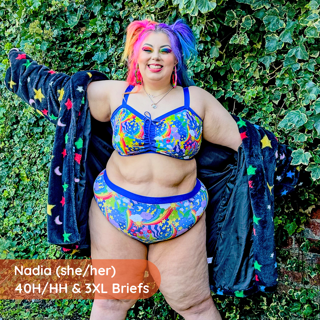 Nadia is outside wearing a retro rainbow flexi bra and high rise briefs