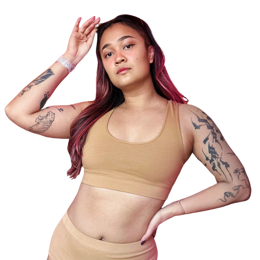 Sarah is wearing a  firmer fit nude skin tone cotton racerback bralette