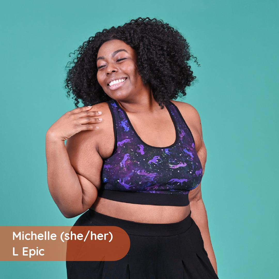 Michelle is wearing a universe bralette and black trousers