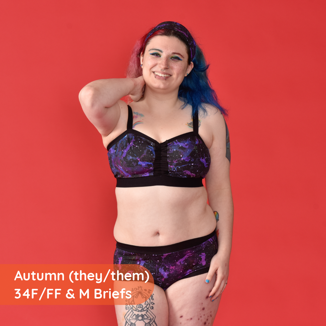 Autumn is wearing mid rise briefs and non wired bra in a unicorn galaxy pattern