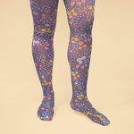 A pair of legs wearing wildflowers tights