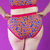 Close crop of Katy wearing high rise cotton briefs in bright colours