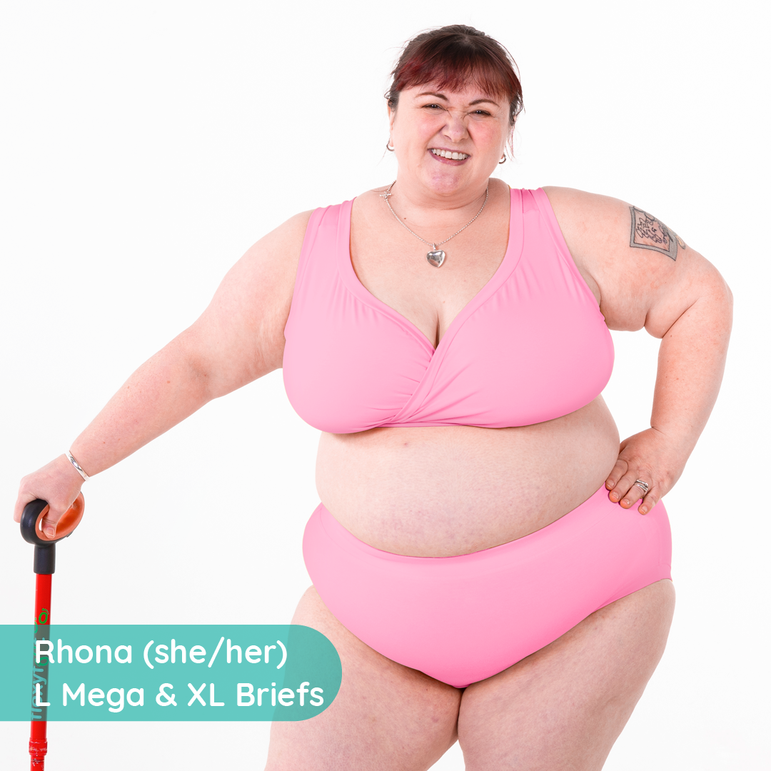 Rhona is standing wearing light pink cotton underwear