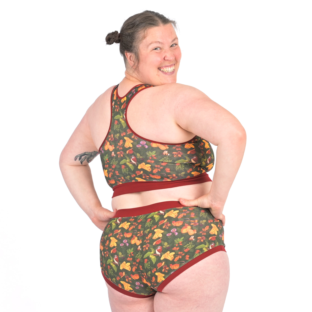 Katy looking over her shoulder wearing Forager woodland racerback bralette and mid rise cotton briefs