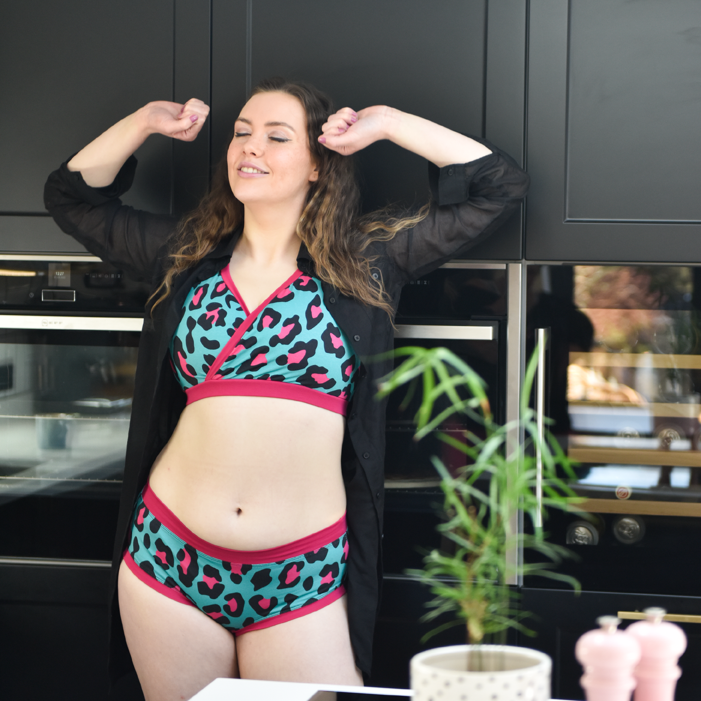 Alice is in her kitchen wearing a hot leopard underwear set
