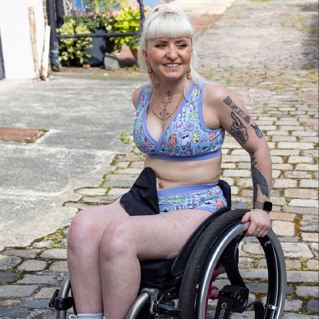 Jess is wearing an Original bra and briefs in an outside courtyard