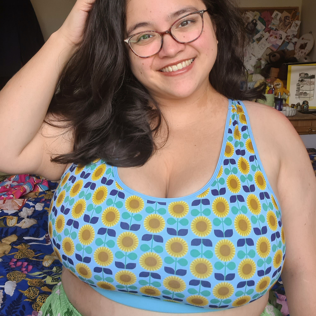 Janine is wearing a sunflowers racerback bralette