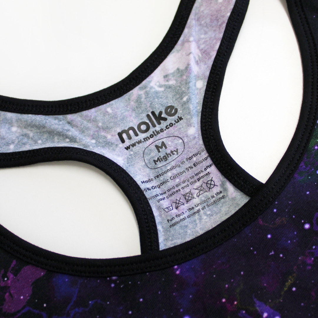 Close up of printed sensory friendly label on universe racerback bralette