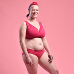 Claire is wearing a non wired raspberry pink bra with low rise pink briefs
