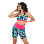 Tinashe is wearing teal and pink leopard print racerback bralette and shorts