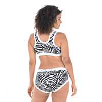 Back view of Tinashe wearing a zebra print monochrome underwear set