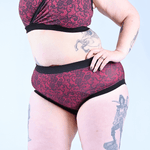 cropped image of cherry lace period pants and bra