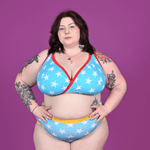 Molly is wearing a blue bra with white stars and high rise briefs.
