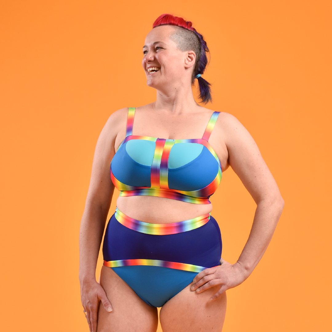 Claire is wearing a blue rainbow non-wired bikini and high waist swim briefs