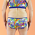 Back view of low rise retro rainbows briefs