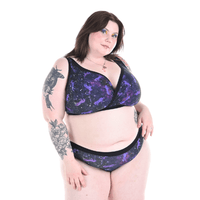 Molly is wearing a Universe underwear set with unicorns in space