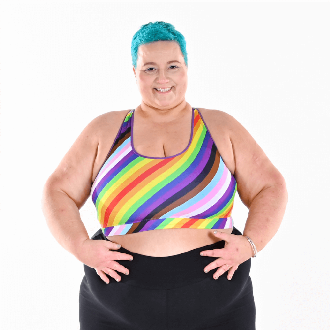 Estelle is wearing a progress pride rainbow fuller bust bralette