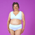 Anita is wearing high rise white briefs and bra