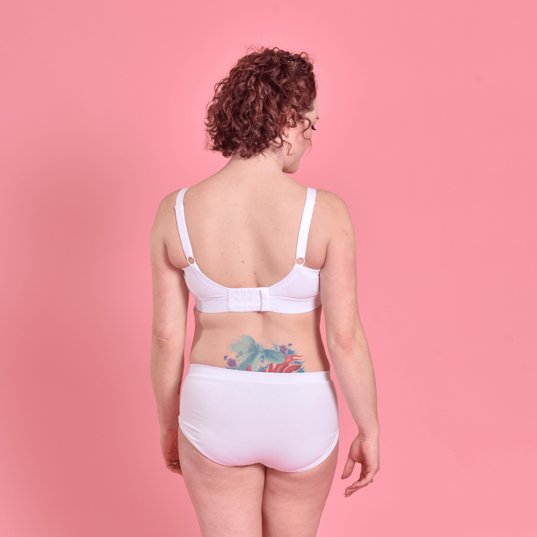 Jenni is wearing a white cotton Flexi size bra and briefsshowing adjustable back and straps