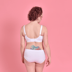 Jenni is wearing a white cotton Flexi size bra and briefsshowing adjustable back and straps