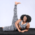 Michelle is on a black fluffy rug wearing zebra leggings and bra